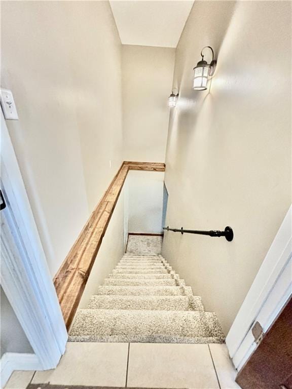 staircase with tile patterned floors