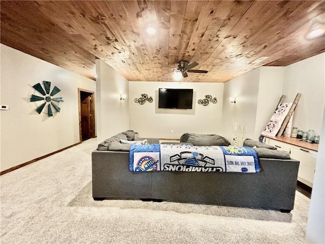 cinema room featuring ceiling fan, carpet floors, and wooden ceiling