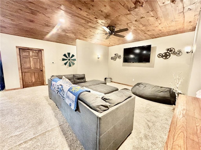 carpeted home theater with wood ceiling and ceiling fan