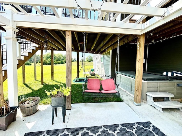 view of patio / terrace with a hot tub