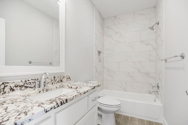 full bathroom featuring vanity, toilet, tub / shower combination, and wood finish floors