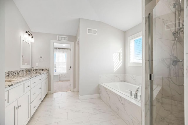 full bath with a marble finish shower, lofted ceiling, visible vents, and marble finish floor