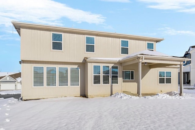 view of snow covered house