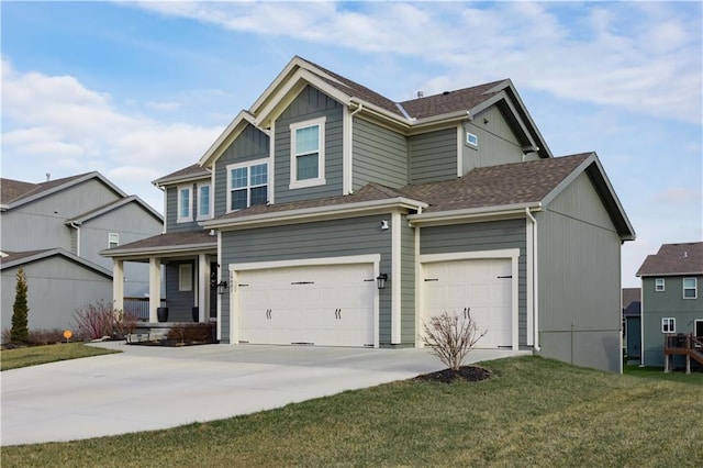 view of front facade featuring a front yard and a garage