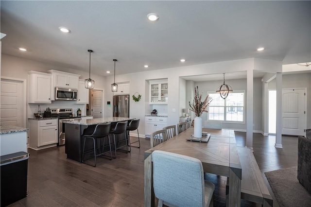 dining space featuring dark hardwood / wood-style floors