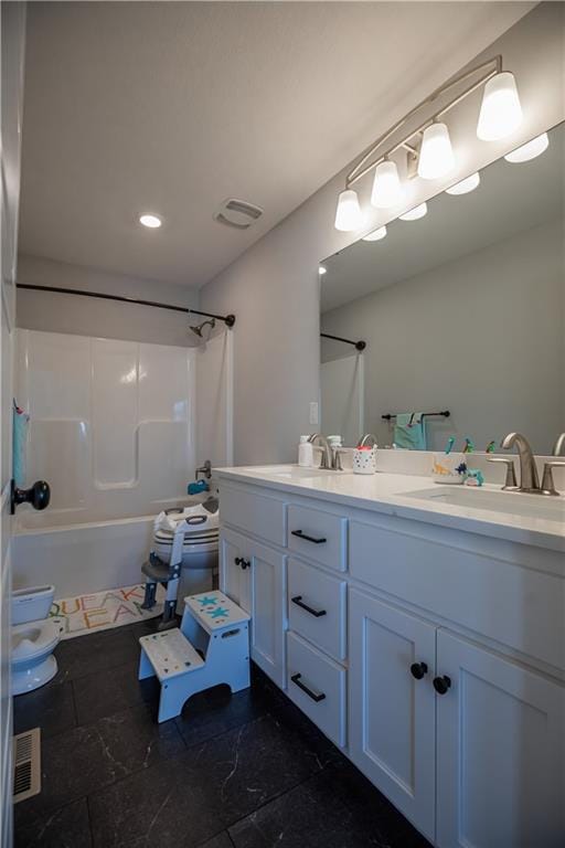 full bathroom featuring vanity, toilet, and shower / washtub combination