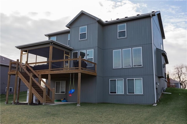 back of house with a lawn and a wooden deck