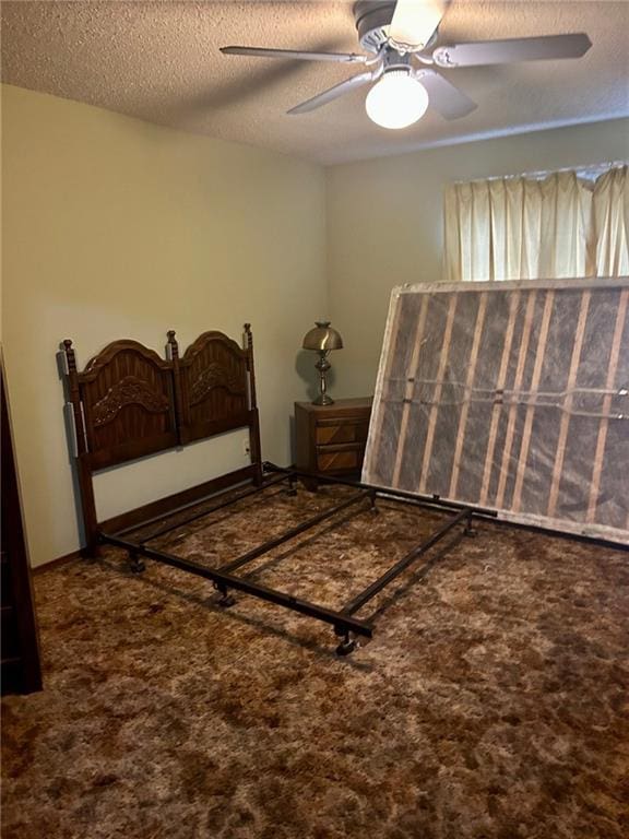 bedroom with carpet and a textured ceiling