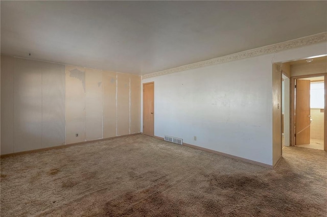 unfurnished room featuring carpet flooring