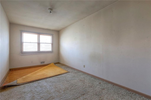 unfurnished room featuring hardwood / wood-style flooring