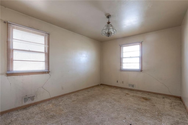 unfurnished room featuring carpet floors