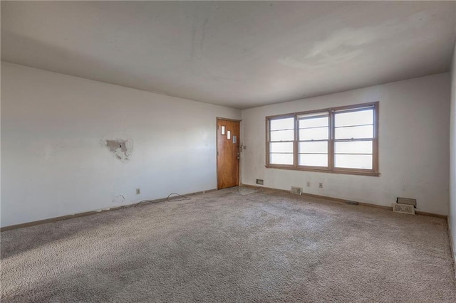 unfurnished room featuring carpet floors