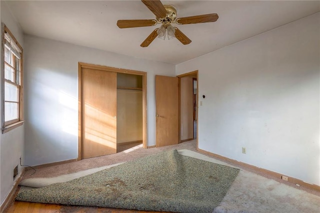 unfurnished bedroom featuring a closet and ceiling fan