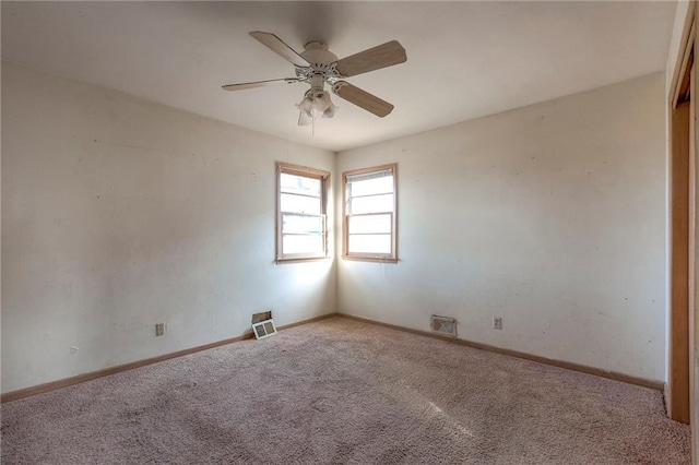 carpeted empty room with ceiling fan