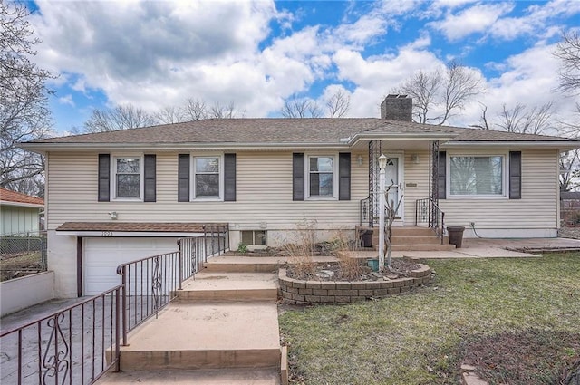 view of front of home featuring a chimney, an attached garage, fence, driveway, and a front lawn