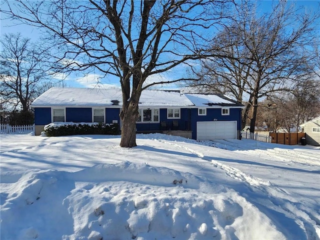 ranch-style home with a garage