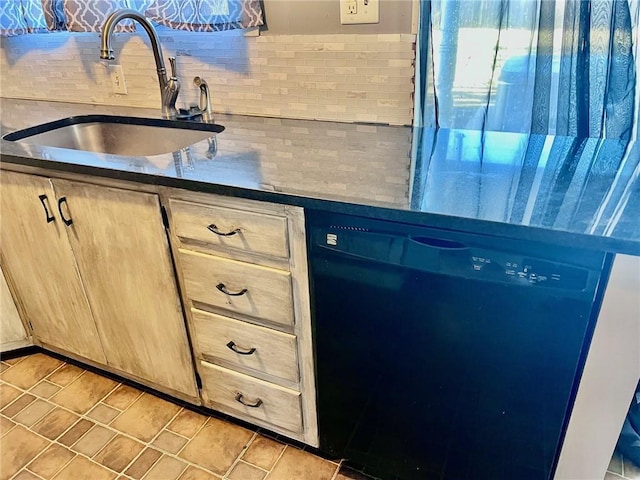 kitchen featuring dishwasher, sink, and light brown cabinetry