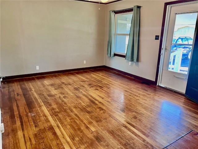 spare room with hardwood / wood-style flooring