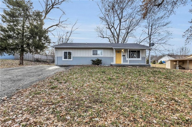 ranch-style home with a front lawn