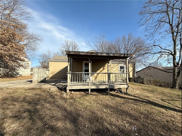 rear view of house with a porch