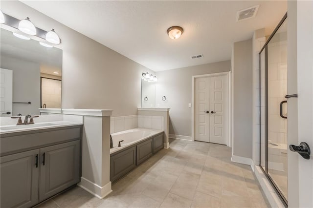 bathroom with vanity, separate shower and tub, and tile patterned floors