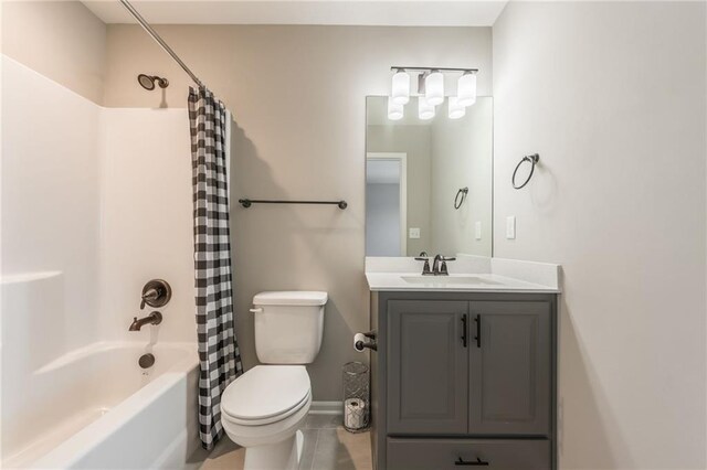 full bathroom featuring vanity, shower / bath combination with curtain, and toilet