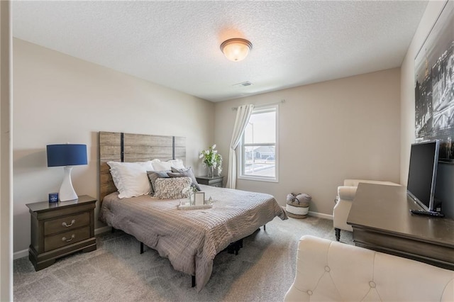 carpeted bedroom with a textured ceiling