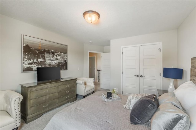 bedroom with a closet and carpet flooring