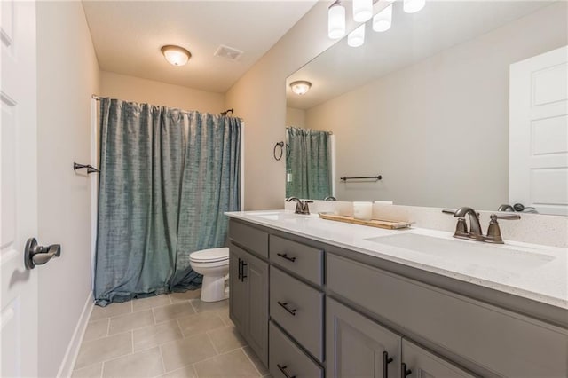 full bathroom featuring vanity, toilet, tile patterned flooring, and shower / bath combo