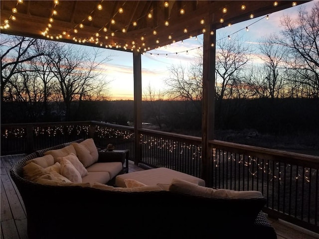 wooden deck with an outdoor living space