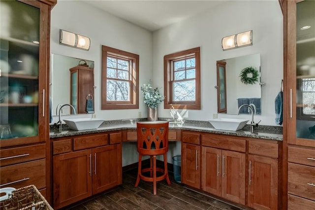 bathroom with wood finish floors and vanity