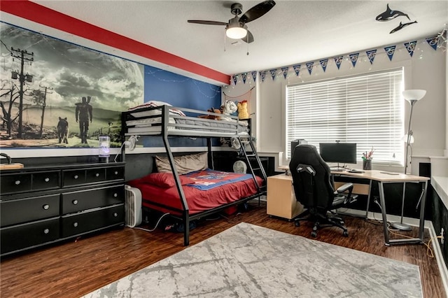 bedroom featuring wood finished floors and a ceiling fan