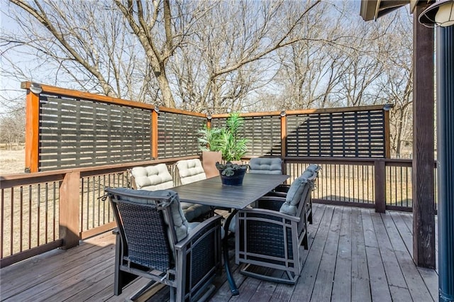 deck with outdoor dining area