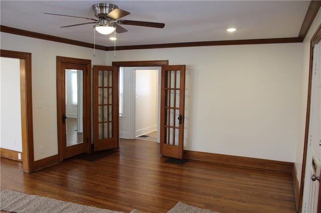 unfurnished room with dark hardwood / wood-style floors, ceiling fan, crown molding, and french doors