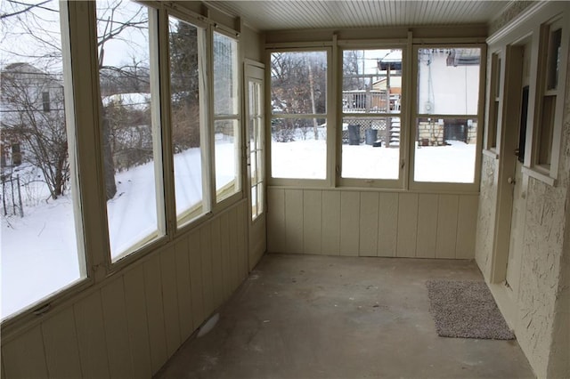 unfurnished sunroom featuring a healthy amount of sunlight