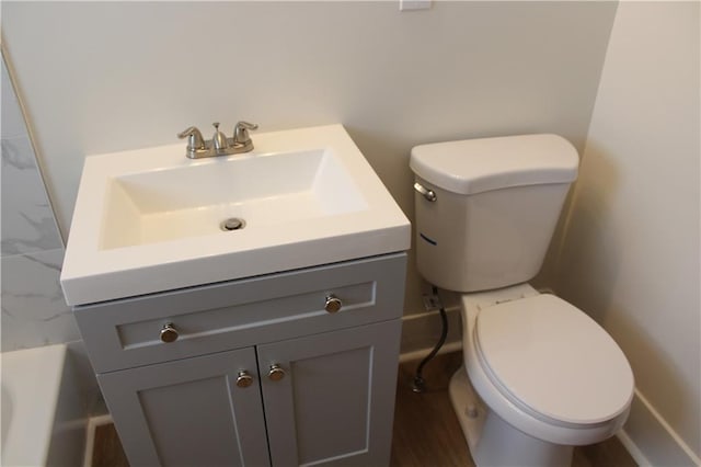 full bathroom with toilet, vanity, and separate shower and tub