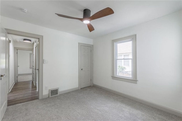 unfurnished bedroom featuring carpet flooring and ceiling fan