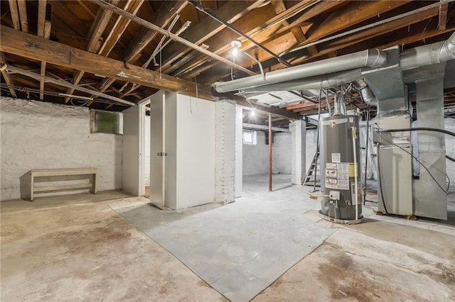 basement featuring heating unit and gas water heater