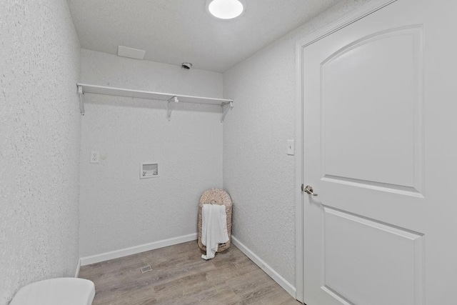 washroom featuring washer hookup and light wood-type flooring