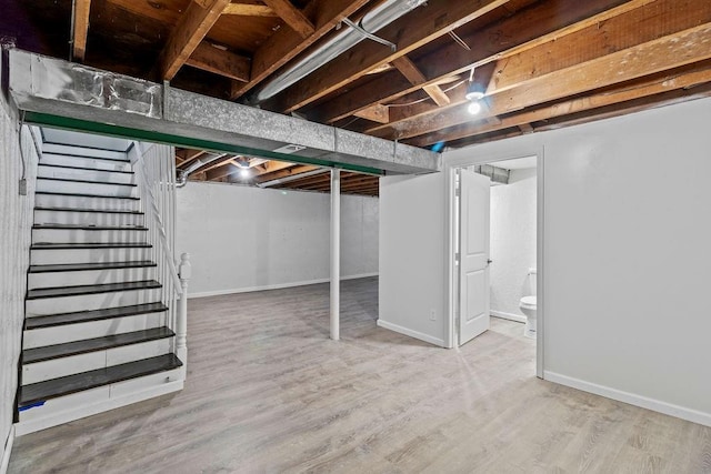 basement featuring hardwood / wood-style flooring