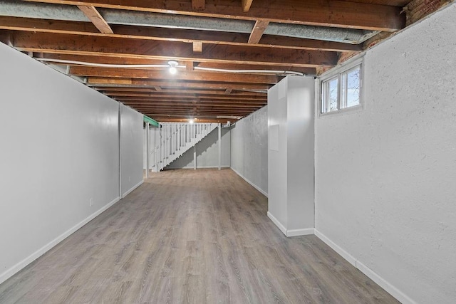 basement featuring wood-type flooring