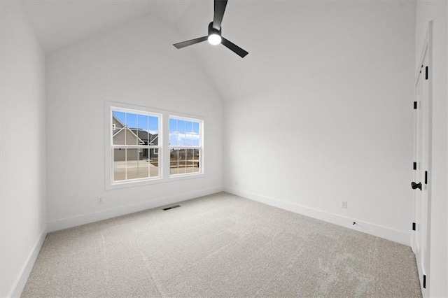 empty room with carpet, high vaulted ceiling, and ceiling fan