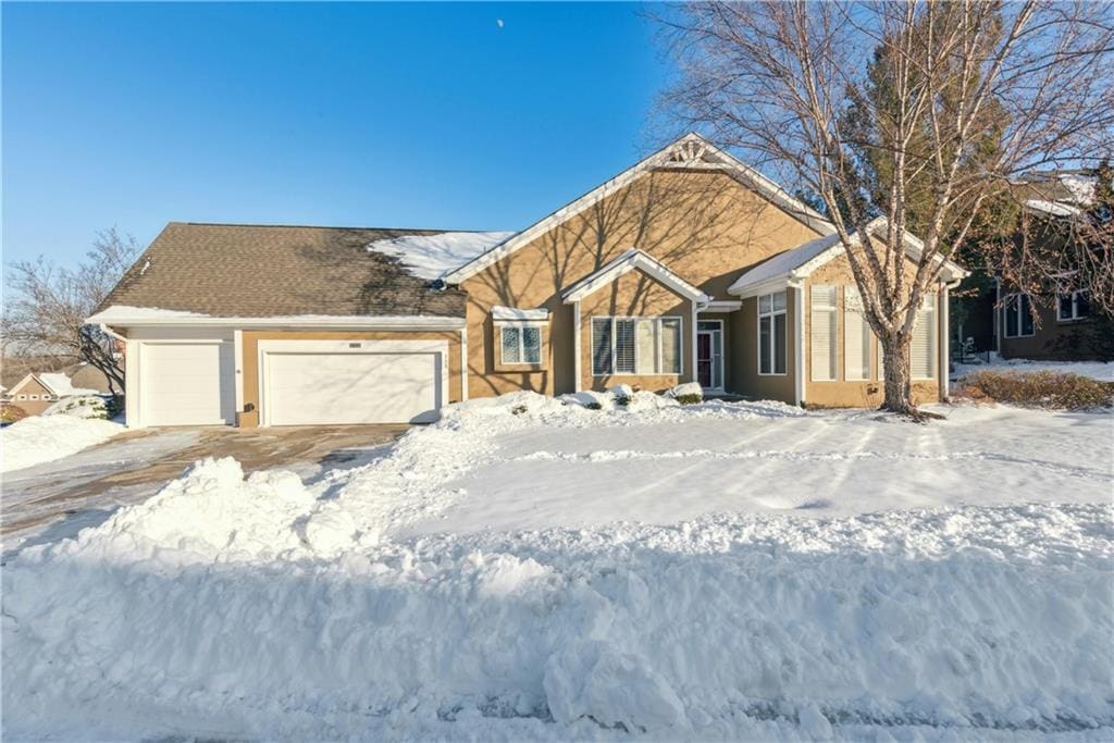 single story home featuring a garage