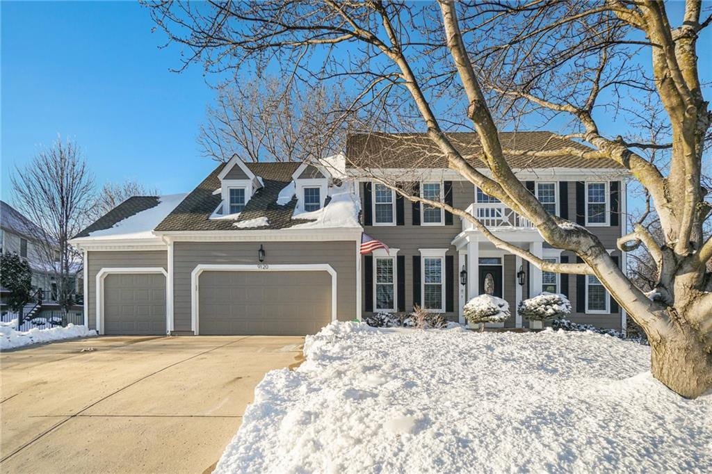 colonial-style house featuring a garage