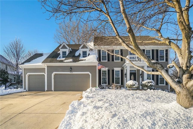 colonial-style house featuring a garage