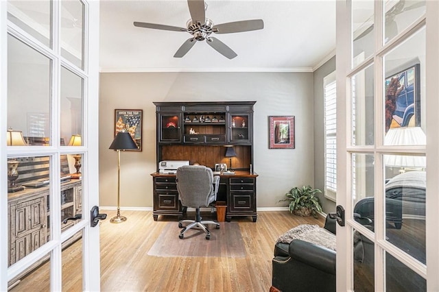 office space featuring hardwood / wood-style flooring, ceiling fan, crown molding, and french doors