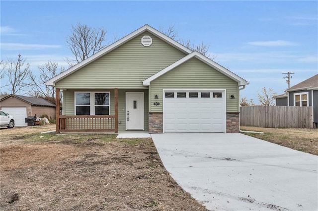 view of front of property featuring a garage and a porch