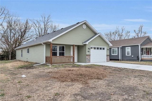 ranch-style home with covered porch and a garage