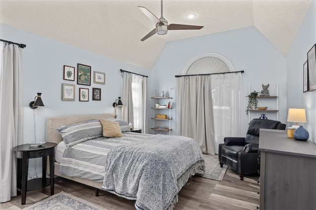 bedroom featuring lofted ceiling, ceiling fan, and wood finished floors