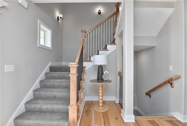 stairway featuring hardwood / wood-style flooring